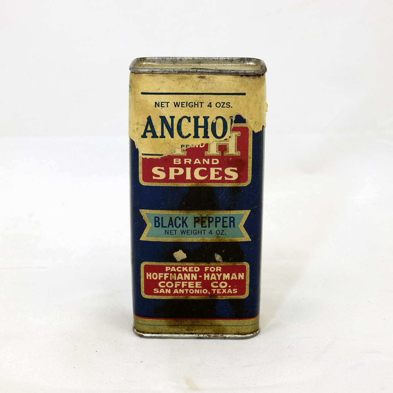 H and H black pepper tin with overwrap remnants