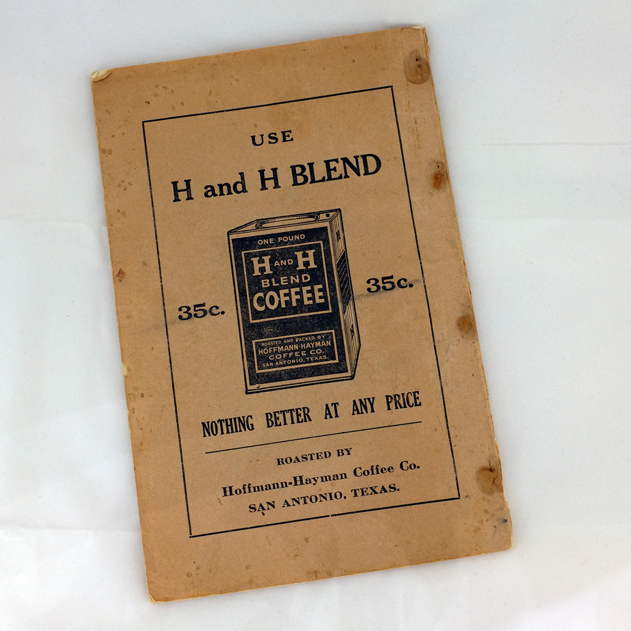 Alamo Cook Book back cover — H and H Blend ad Back cover ad for H and H Blend, 35c one-pound tin line art, "Nothing better at any price," roasted by Hoffmann-Hayman Coffee Co. San Antonio