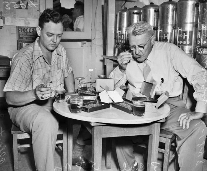 Gus P. Menger and son Albert testing coffee — UTSA San Antonio Light Collection Gus P. Menger and son Albert testing coffee — UTSA San Antonio Light Collection