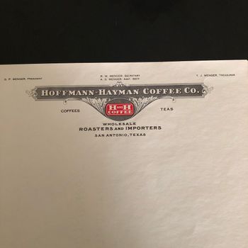 Close-up of the letterhead masthead showing the dark banner "Hoffmann-Hayman Coffee Co.", the red H and H Coffee oval logo, "Wholesale Roasters and Importers — San Antonio, Texas", and the full officer line: G. P. Menger President; R. W. Menger Secretary and A. G. Menger Asst. Secy; T. J. Menger Treasurer.